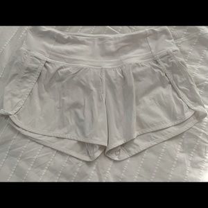EUC Lululemon Speed Up shorts in white